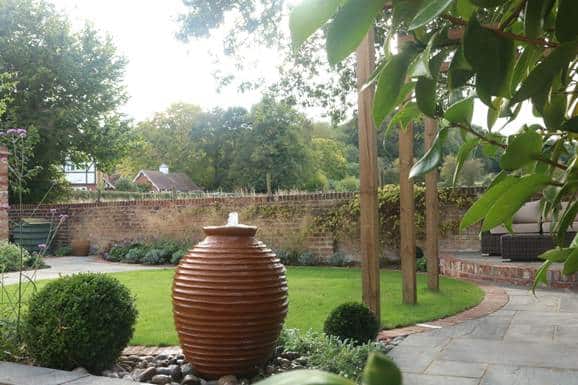 Garden with a water fountain surrounded by planting attracting birds and wildlife